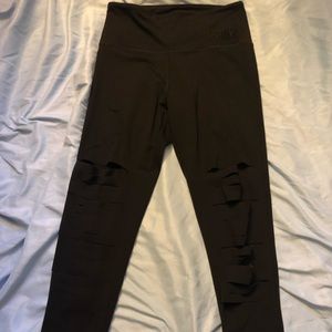 Black Victoria Secret Pink leggings with rips
